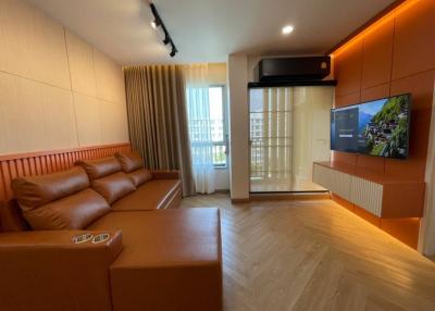 Contemporary living room with ample seating and modern amenities