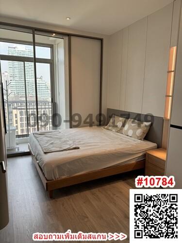 Modern bedroom with large window and city view