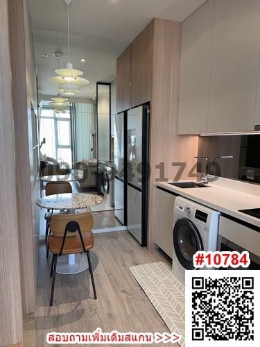 Modern kitchen with dining area and integrated appliances