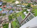 Aerial view of residential building with green rooftop