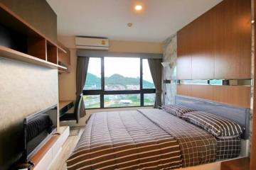 Modern bedroom with a view of the hills