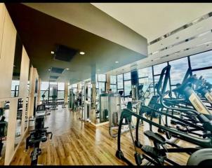 Modern gym facility within residential building with various exercise equipment