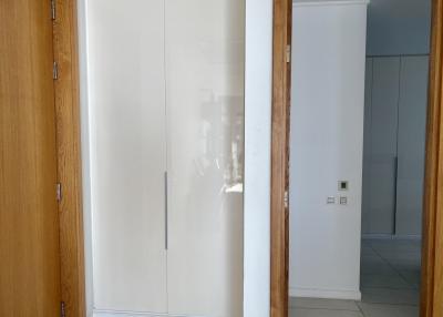 Bright hallway interior with wooden doors and frosted glass panels