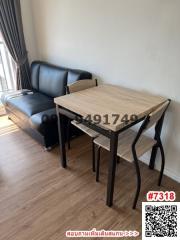 Compact dining area with table and chairs near window