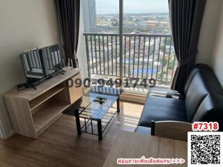 Spacious living room with modern furniture and balcony access