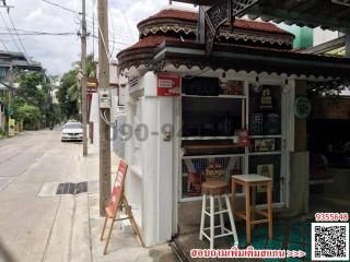 Exterior view of a small commercial building with eclectic decoration