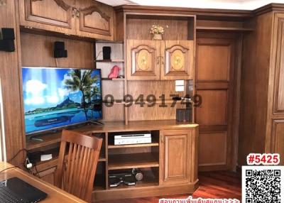 Wooden furnished living room with entertainment system