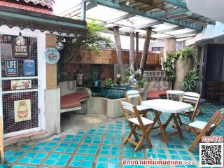 Cozy outdoor patio with seating and greenery