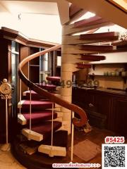 Elegant spiral staircase with carpeted steps in a home interior