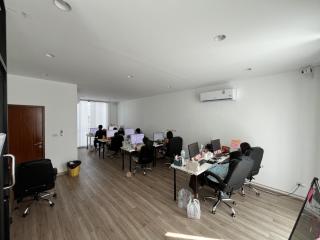 Spacious office space with multiple workstations and natural light