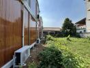 Modular container home exterior with adjacent garden area