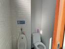 Modern bathroom with white subway tiles and sleek fixtures