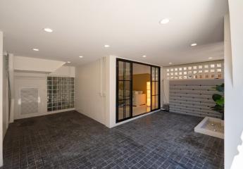 Modern living room leading to a cozy patio