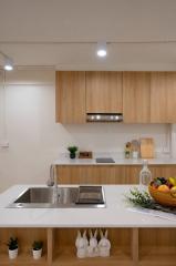 Modern kitchen with wooden cabinets and stainless steel appliances