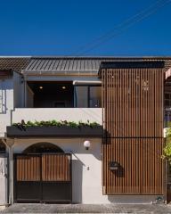 Modern two-story residential home with stylish wooden slat facade