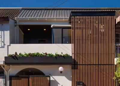 Modern two-story residential home with stylish wooden slat facade