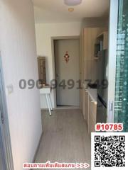 Modern hallway interior with entrance door and kitchenette