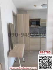 Compact modern kitchen with wood finishes and built-in appliances