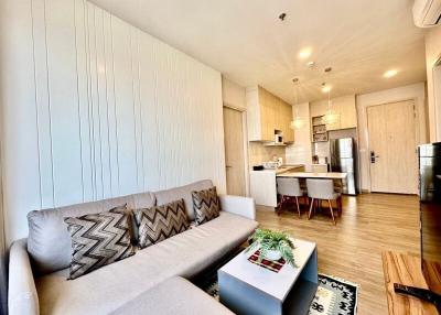 Modern living room with open-plan kitchen and dining area