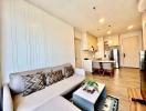 Modern living room with open-plan kitchen and dining area