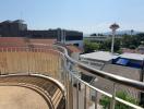 Spacious balcony with city view and clear skies