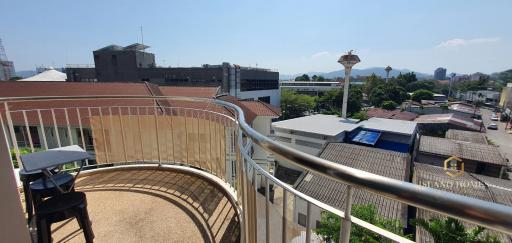 Spacious balcony with city view and clear skies