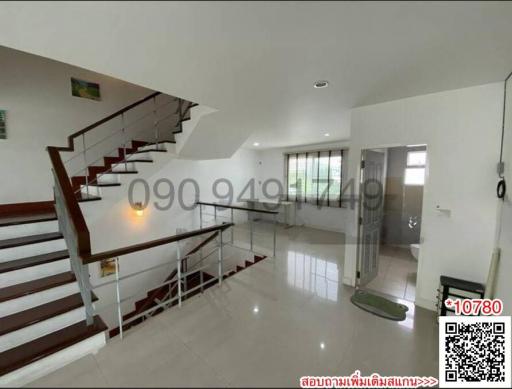 Bright and spacious home interior with staircase and open floor plan