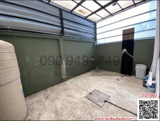 Spacious garage with concrete flooring and storage capacity