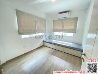 Bright and minimalist bedroom with air conditioning and large windows