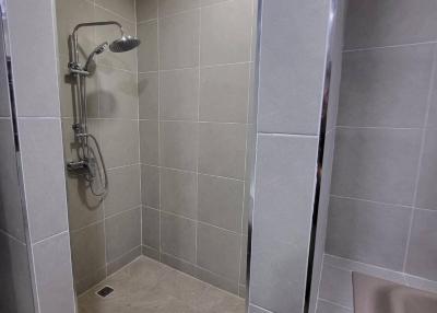 Contemporary bathroom with walk-in shower and grey tiles