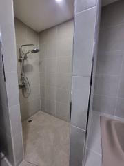 Contemporary bathroom with walk-in shower and grey tiles