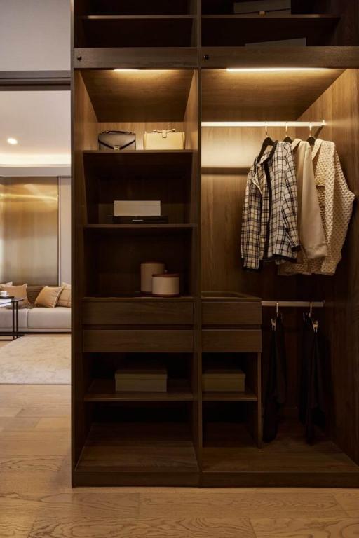 Elegant wooden entryway closet with open shelving and hanging space