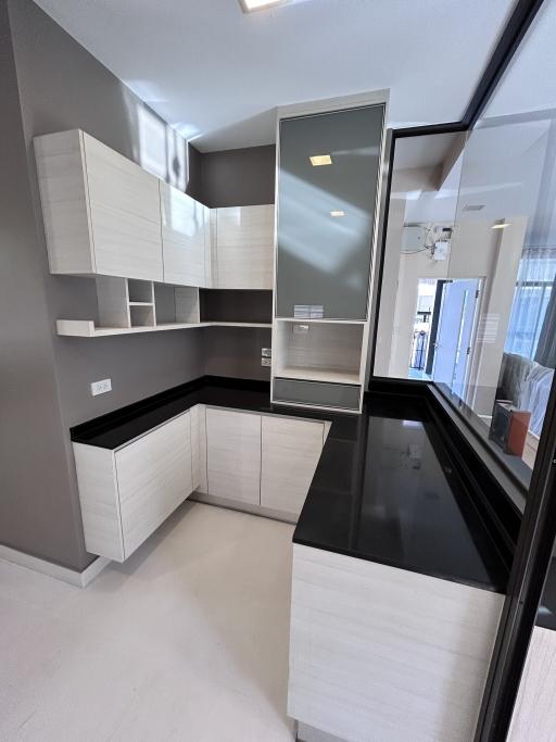 Modern kitchen with stainless steel appliances and sleek cabinetry