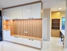 Modern kitchen with white cabinetry and wooden accents