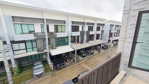 Modern residential townhouses with balcony and private car spaces