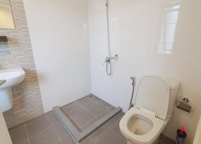 Modern bathroom with walk-in shower and white fixtures