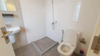 Modern bathroom with walk-in shower and white fixtures