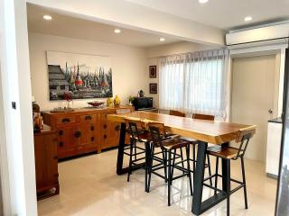 Modern kitchen with spacious wooden dining area