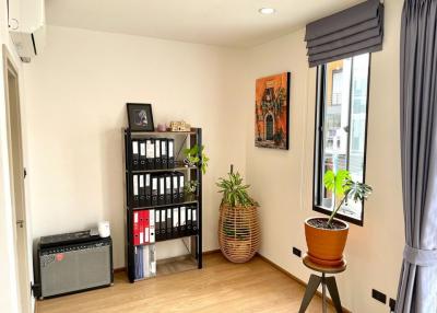 Cozy and well-lit living room corner with decorative items