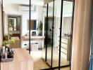 Modern apartment interior with kitchen view through a reflective glass partition