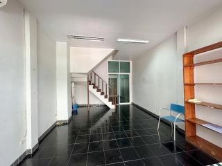 Spacious interior with staircase and tiled floor