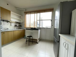 Spacious kitchen with modern appliances and ample natural light