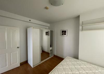 Spacious bedroom with large closet and hardwood floors