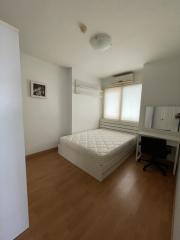 compact bedroom with natural light and hardwood floor