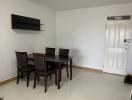 Spacious dining room with a dark wooden table and chairs set