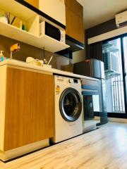 Modern kitchen with stainless steel appliances and wooden cabinetry