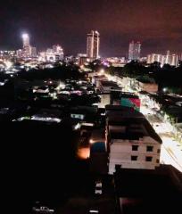 Night View of a City with Illuminated Buildings