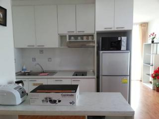 Modern kitchen with stainless steel appliances and white cabinetry