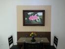 Contemporary dining room with a wooden table, modern chairs, and an artistic light fixture