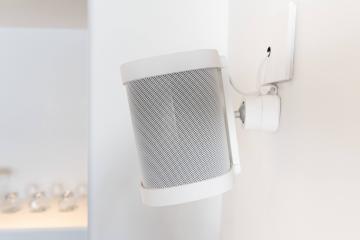 Wall-mounted speaker in a modern room